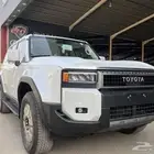 تويوتا برادو 2025 تي اكس ال 2 اقساط بنزين ابيض لؤلؤي .