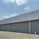 محلات تجاريه وخلفها مستودع قريب من مجلبه الغنم