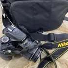 كاميرا احترافية ( Nikon ) وجميع ملحقتها شبة جديدة