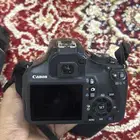 كامره كانون نوع كامره EOS 1100D مع شاحنها وزوم نوع LENS300