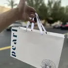 طباعة بكج تغليف عبايات اكياس ليبل قماش تاقات ورق تغليف