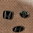 ملصقات بشعارات السيارات