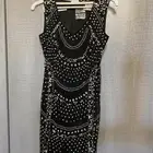 فساتين و شنطة وكعب جلد