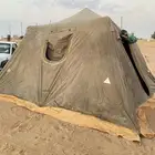 خيمه البيرق 5 في 5 نضيفه ضد الماء به شق بسيط والى يضر