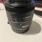 عدسة كانون اس تي ام 50 ملم f 1.8 و محول EF-M