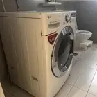 غسالة مع مجفف حار LG بحالة جيدة
