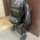 عربة أطفال توأم