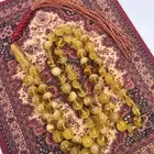 كهرمان طبيعي عسلي منوصف اغلب الخرز