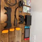 نينتندو سويتش كامل مع مسكتين مع ثلاث أشرطة مجانا  و 400Gb