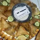 سمبوسة لحم طازجه مع الصوص