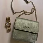 حقيبة tous مع ساعة