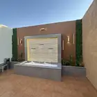 تنسيق حدائق شلالات مظلات وجلسات خارجية