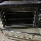 فرن كهربائي بس انه يحتاج تركب الباب حقه