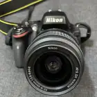 كاميرا Nikon D5100 مع عدسة
