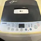 غساله ملابس LG اتوماتيك تعبئة علويه حجم 9.50 كم بحالة جيدة