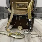 مجموعة تراثية شنطة قديمه وساعات جيب وخناجر