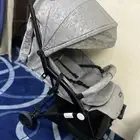 عربه اطفال وسرير اطفال وكرسي للاكل