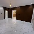 شقه تمليك ارضي خلفيه حي البوادي 4 وصاله
