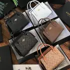 شنط ماركة كوتش بسعر مخفض