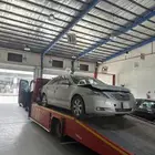 سطحه لتقدير السيارات المصدوم ونقل السيارات