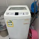 غسالة تعبئة علوية بحالة جيدة مع ميكرويف يلزمه اصلاح