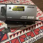 كميرا فديو وصور مع حقيبه وشاحن وسلك التلفزيون