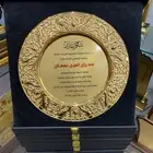 تصميم وتنفيذ دروع تذكاريه جلد _خشب _ كريستال  كروت شخصية