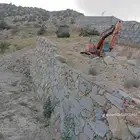 بوكلين لبناء الحجر وقص الاراضي وهدم العمائر القديمه