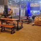 كرسي حديقة خشبي بيد ذات انحناءات جمالية