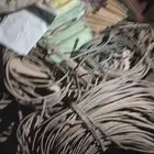 ماكينات ومخرطة وحديد واستاندات مستودع وأسلاك وكراتين وورق