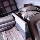 كنب جلد فاخر مع دولاب ارفف خشب