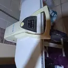 مكواة وكرسي العاب وكرسي متحرك وطاولة ارضية وجهاز هواء