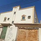 عمارة دورين كل دور خمس غرف وحمامين ومطبخ وصالة ا