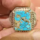 خاتم فيروز نيشابوري بعروق ذهبيه