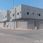 عمارة للبيع في حي المطار شارعين