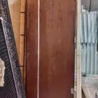 عندنا ابواب خشب مستخدمه وابواب حديد والمنيوم جديده للبيعه