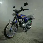 أكس 100 وسام ناري أزرق 2026 محول سوزوكي