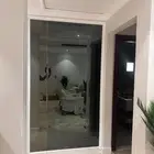 مرايه اسود فاتح مع ديكور مربعات