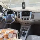 تويوتا انوفا 2015 أبيض ماشيه 110 الف مالك أول