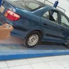 نيسان صني 2001 مكينه مغيرها جير عادي مكيف شغال