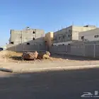 ارض على واجهتين و بمساحه كبيره