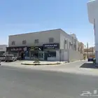 للبيع بالمجمعه عماره تجاريه على طريق الملك فهد