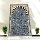 سجادات بتصميم الروضة الشريفة