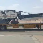 لوبد لنقل المعدات الثقيلة والغرف والسيارات في الباحة وما حول