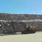 بنيان حجر وقص اراضي بكلين وتحريم وفك الصخور