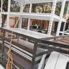 رفوف مستودع او رفوف مطبخ حديد عليها خشب ابيض مستخدم