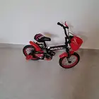 سيكل وكرسي طفل ومحبس ألعاب