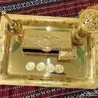 طقم ذهبي مكون من صحن ومبخره ومرش وعلبة مجوهرات