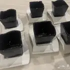 فناجين قهوة وصحون كبيرة وصحون وسط وزبادي شوربه