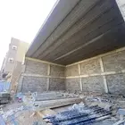 هنجر للإيجار في حي الرابية أمام الريان موقع ممتاز